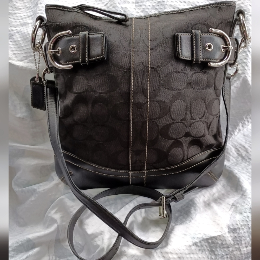 Coach black crossbody with black interior.